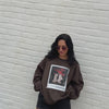 woman wearing graveyard smash sweashirt