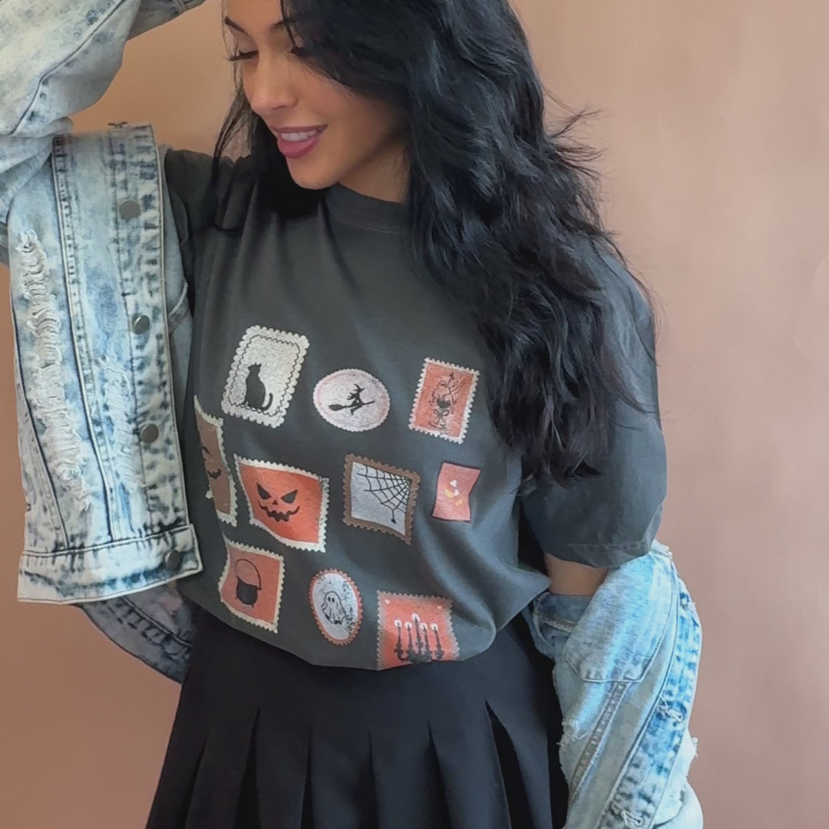 woman wearing spooky stamp collection