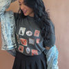 woman wearing spooky stamp collection