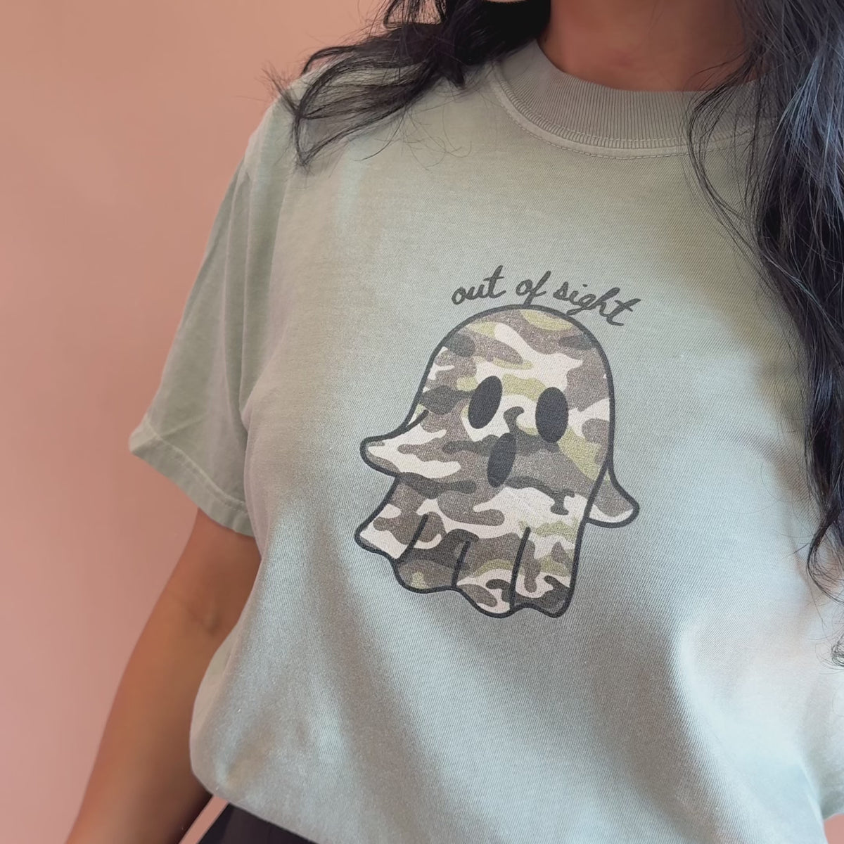 woman wearing out of sight tee