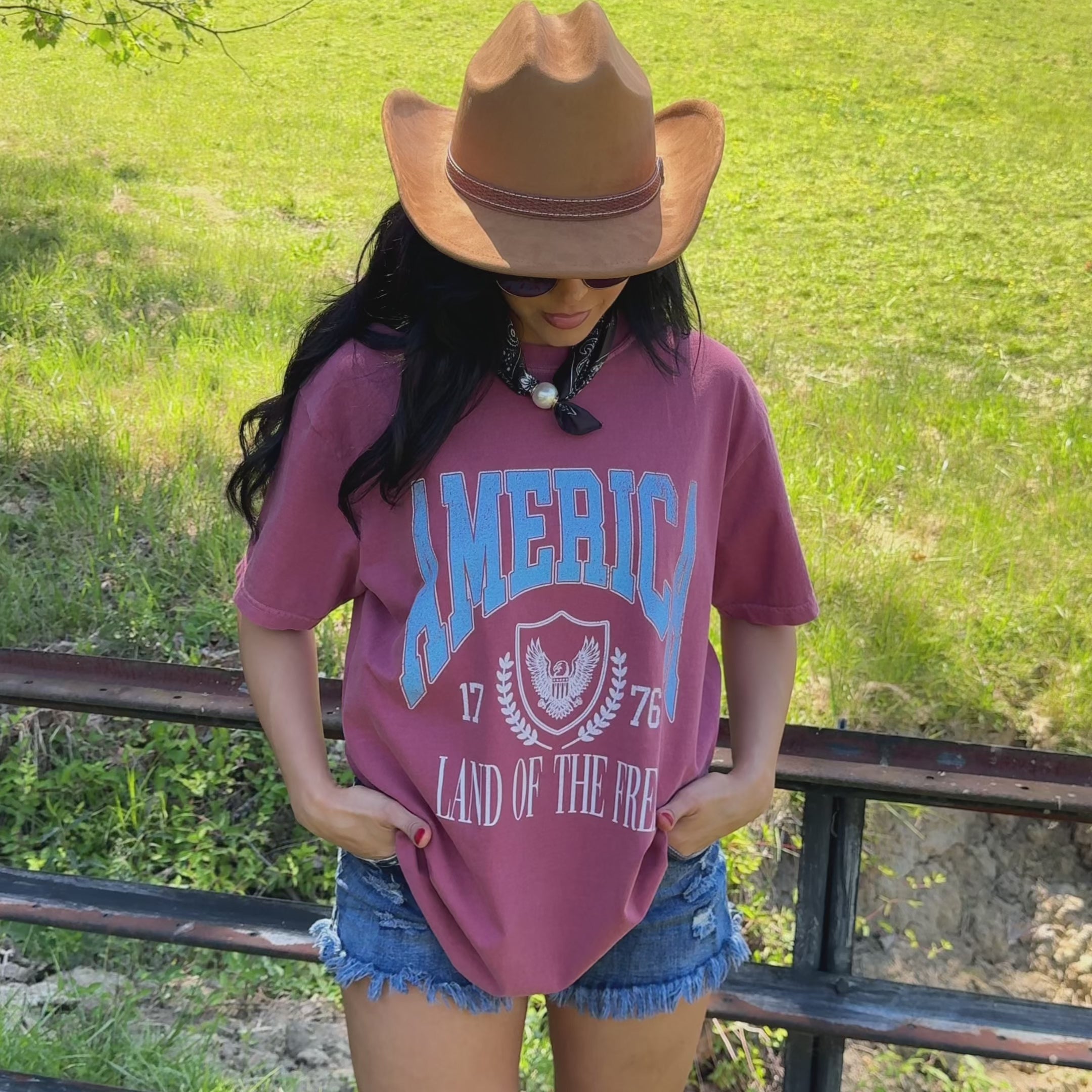 model wearing Land of the Free Collegiate Tee